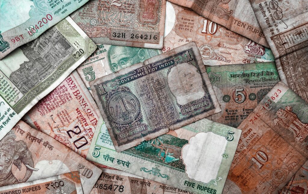 A collection of diverse vintage Indian rupee notes showcasing various denominations and designs.