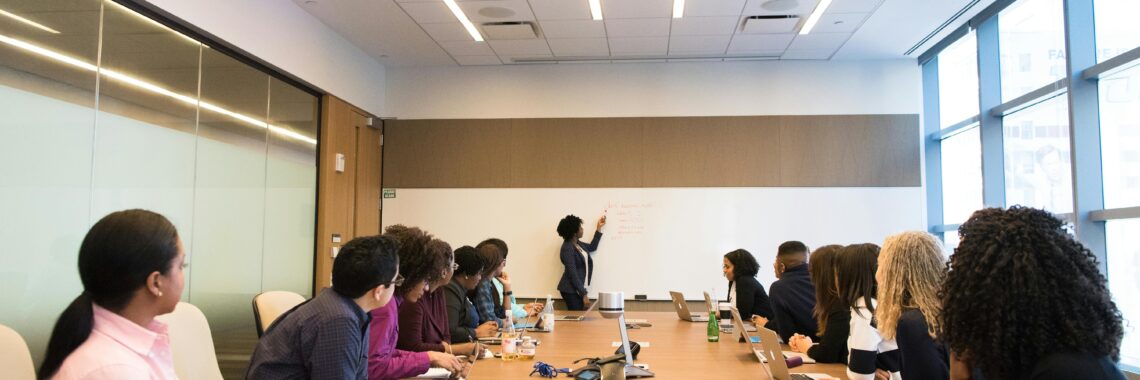 Business meeting with diverse team discussing projects in a modern conference room.